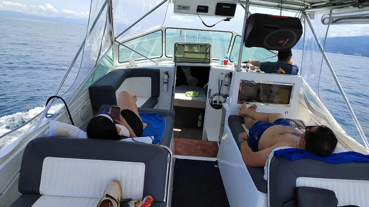 Guests stretched out on the cushions of the Gulf Stream 34 cockpit during an owner-direct boat day