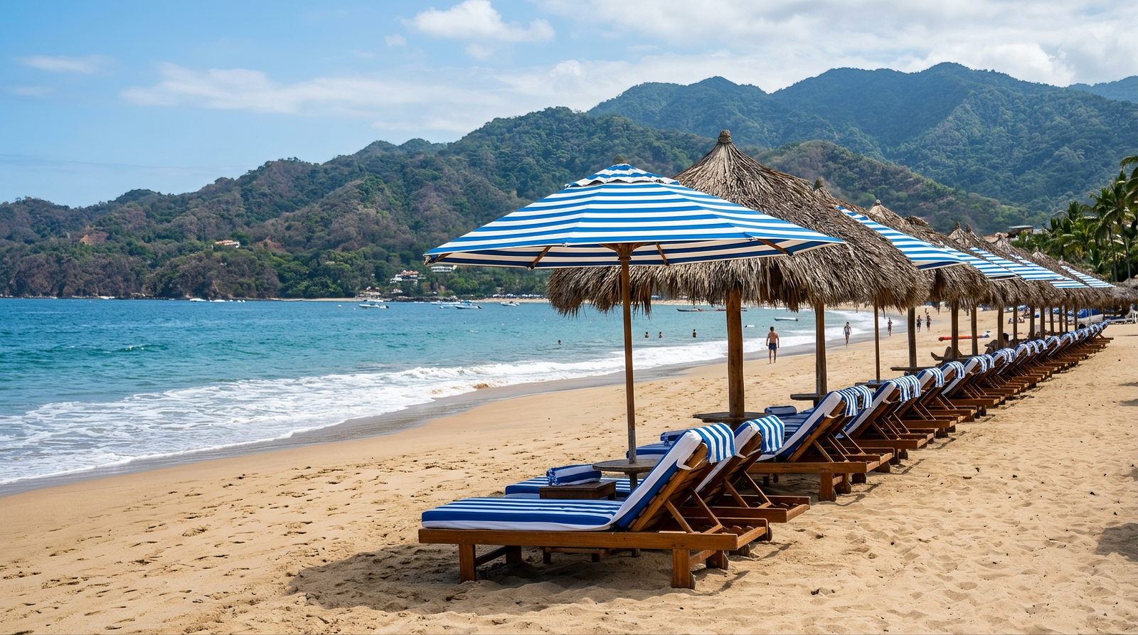 Aerial view of a Puerto Vallarta beach along Banderas Bay with palm trees and clear turquoise water